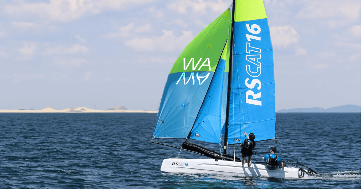 WAMA water sports: Sailboat with blue and green sails.         